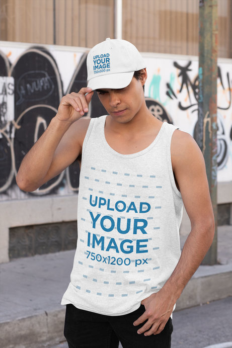 Mockup of a Man Wearing a Tank Top While Holding His Dad Hat