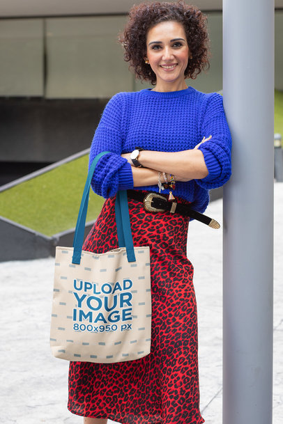 Tote Bag Mockup of a Middle-Aged Woman Leaning Against a Lamp Post 