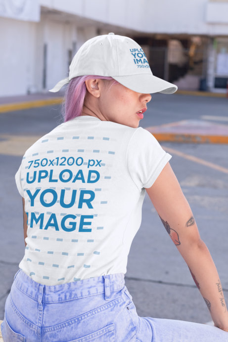 Back View Mockup of a Woman Wearing a Customizable T-Shirt and a Dad Hat 