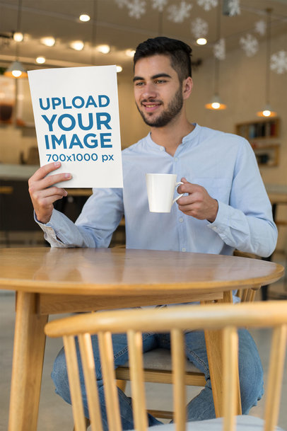 Mockup of a Smiling Man Reading a Magazine at a Cafe