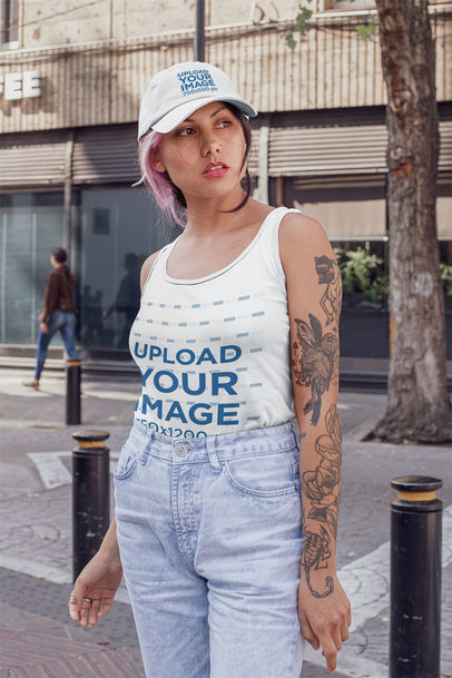 Tank Top and Dad Hat Mockup Featuring a Woman on the Street