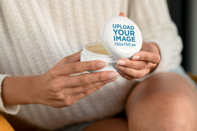 Mockup of a Woman Opening a Cannabis Cosmetic Jar 