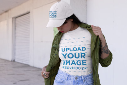 Mockup Featuring a Woman with a Tee and a Dad Hat on the Street