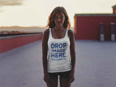 Tank Top Mockup of a Young Woman on a Roof Top at Sundown