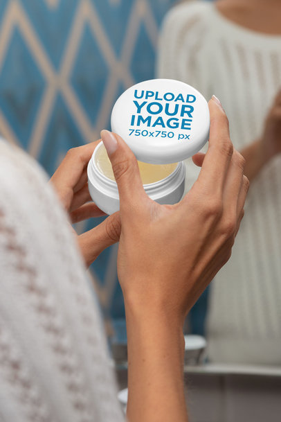 Mockup of a Woman Holding a Cosmetic Jar for Cannabis Products