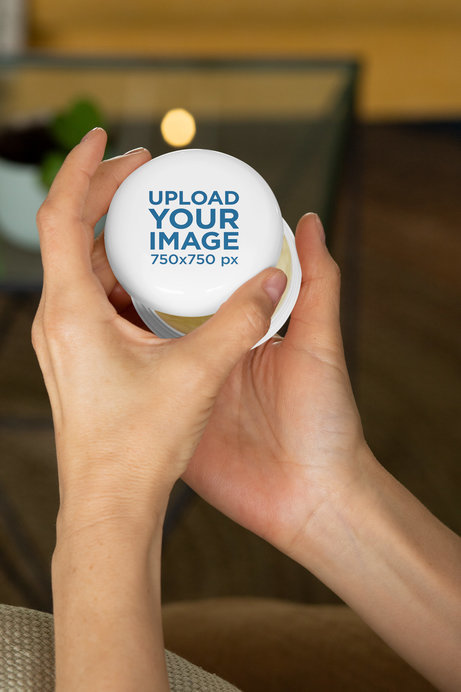 Mockup of a Pair of Hands Opening a CBD Jar 
