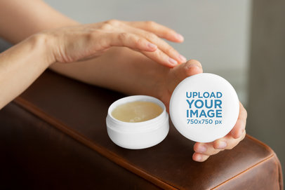 Jar Mockup of a Woman Using Her Beauty Product