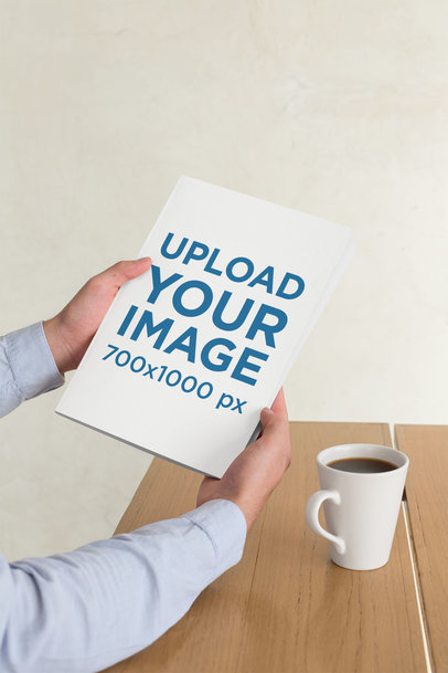 Mockup of a Man Holding a Magazine and Drinking Coffee 31553