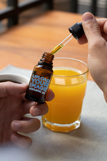 Mockup of a Man Opening a Cannabis Dropper Bottle 