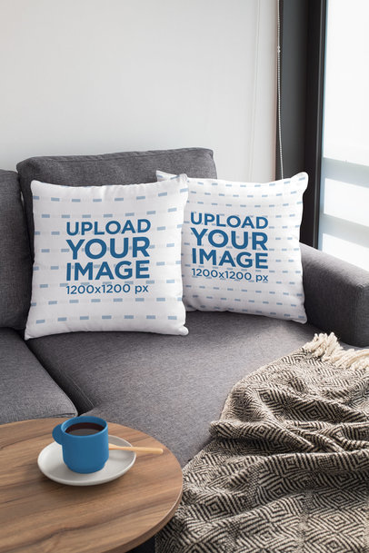 Mockup of Two Squared Pillows on a Couch 