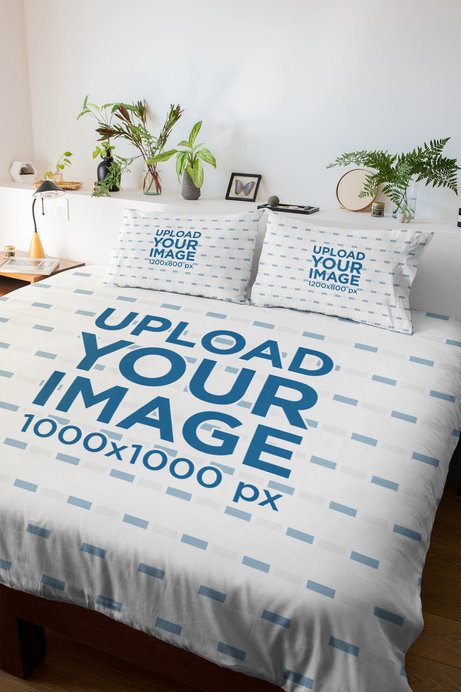 Mockup of a Duvet and Two Pillows in a Bedroom with Plant Decorations 