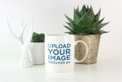 Coffee Mug Mockup Featuring Some Plants and a Decoration Piece 2950-el1