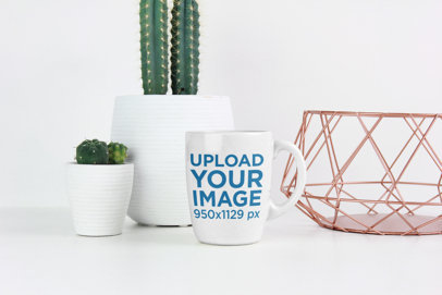 Mockup of an 11 oz Coffee Mug Placed by Small Cacti 