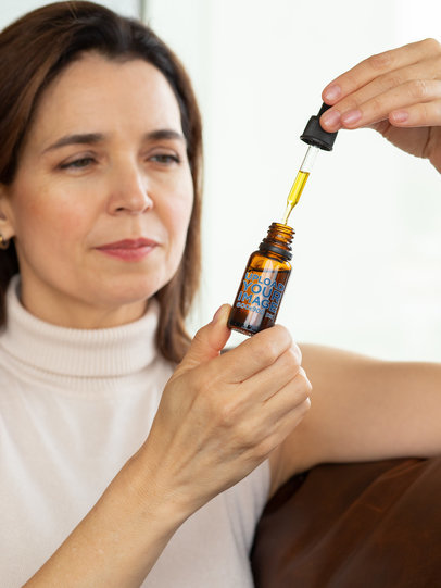 Mockup of a Middle-Aged Woman Using a Dropper