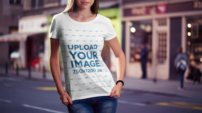 Mockup of a Woman Showing off Her T-Shirt on the Street 