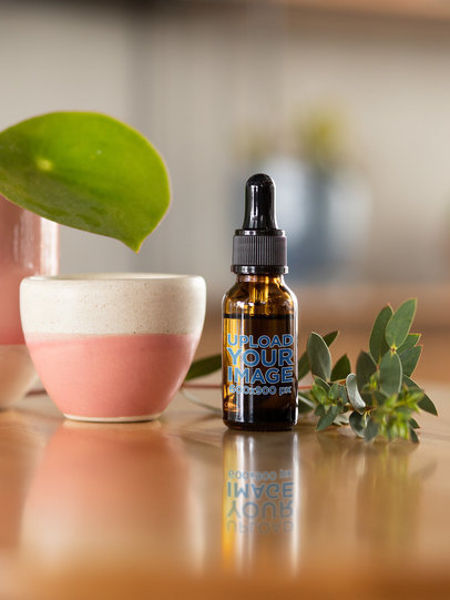 Dropper Bottle Mockup Featuring a Plant Pot 