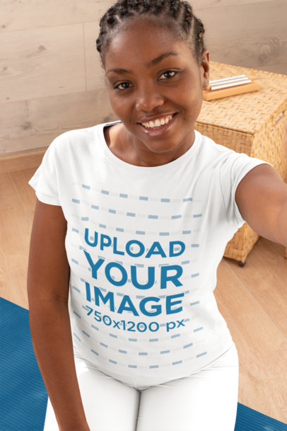Selfie Mockup of a Woman Wearing a T-Shirt at a Yoga Studio