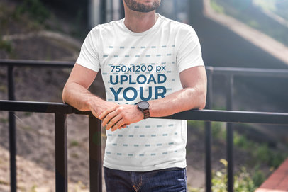 Cropped Face Mockup of a Man Wearing a T-Shirt and Leaning Against a Handrail