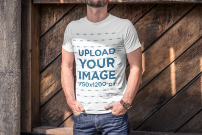 T-Shirt Mockup Featuring a Cropped-Face Man with Hands in His Pockets