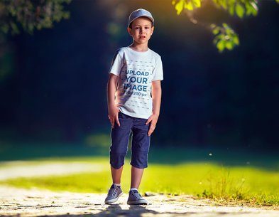 T-Shirt Mockup Featuring a Boy on a Sunny Day