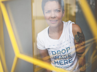T-Shirt Mockup of a Cool Woman with Tattoos Making a Funny Face