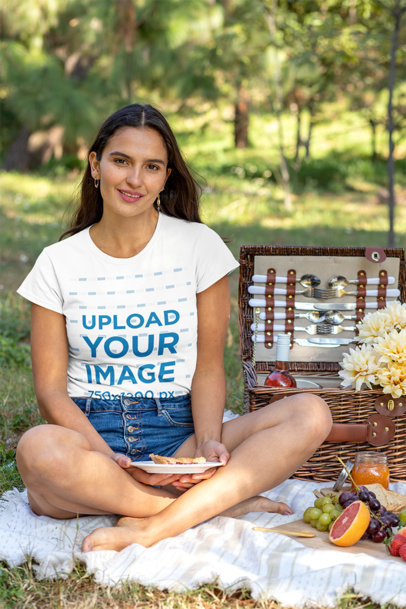 T-Shirt Mockup of a Woman Sitting by a Picnic Basket 