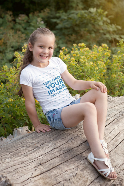 Mockup of a Girl Posing on a Log with a T-Shirt