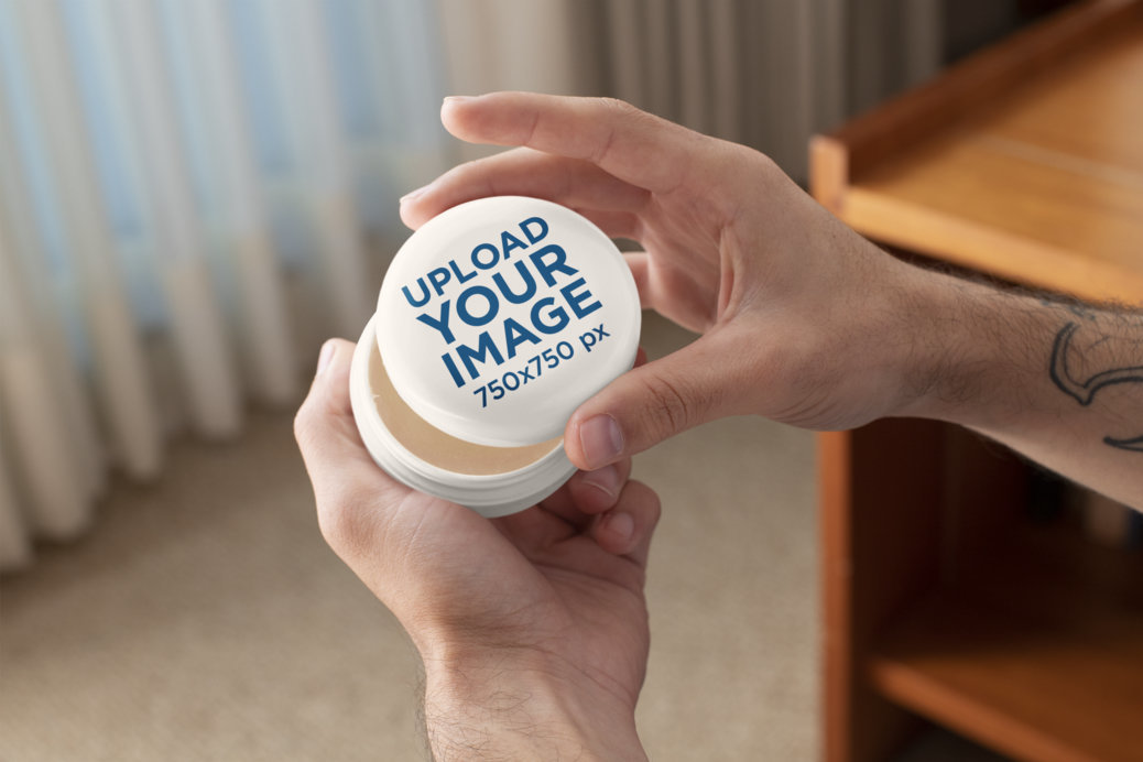 Mockup of a Man Opening a Cosmetic Jar for CBD Products