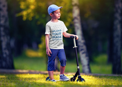 Mockup of a Boy with a T-Shirt Riding a Scooter 