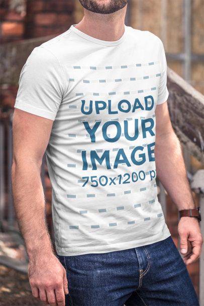 Mockup of a Bearded Man Wearing a Customizable T-Shirt and Denim Jeans 
