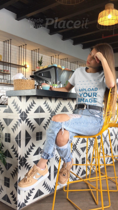 T-Shirt Video of a Young Woman at a Cafe