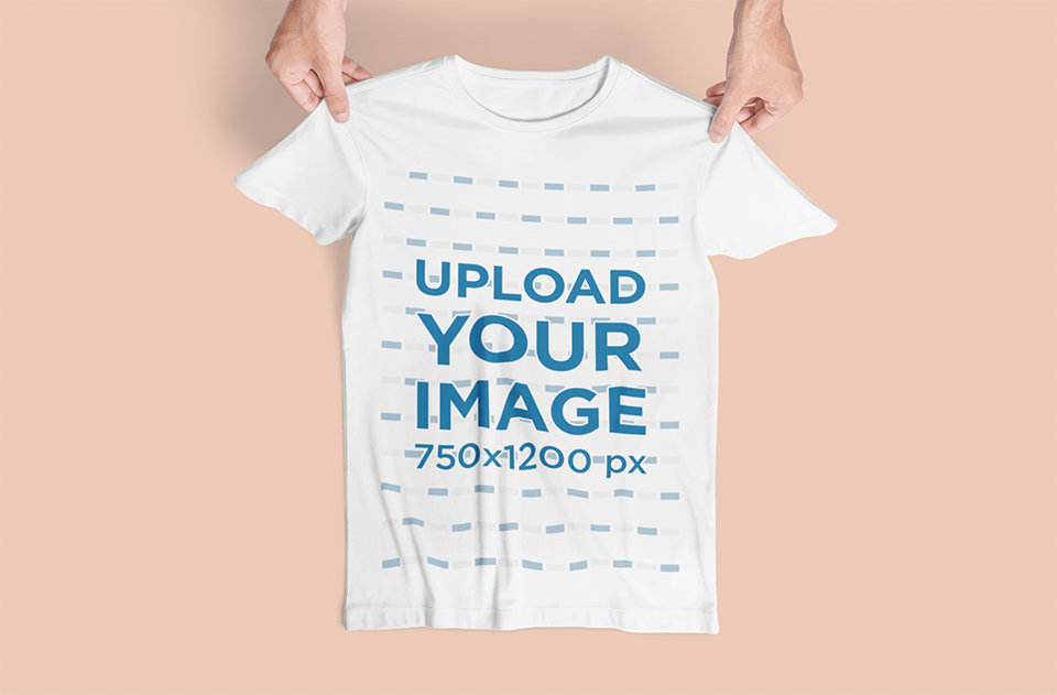Mockup of a Pair of Hands Placing a T-Shirt on a Flat Surface