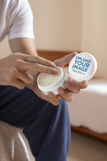 Mockup Featuring a Man Opening a Cannabis-Infused Salve Jar 