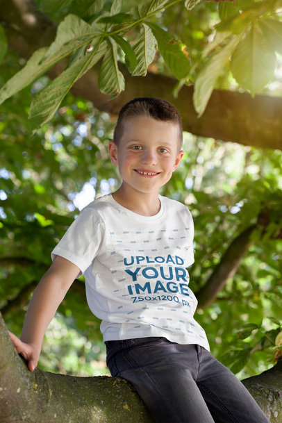T-Shirt Mockup Featuring a Boy Sitting on a Tree