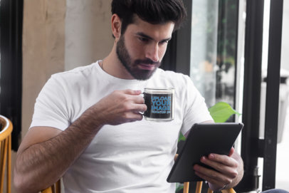 Mockup of a Man Drinking Coffee From a Glass Mug