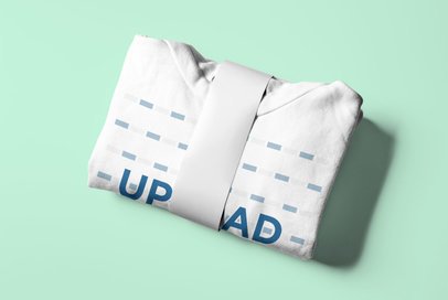 Mockup of a Folded Hoodie Held by a Band