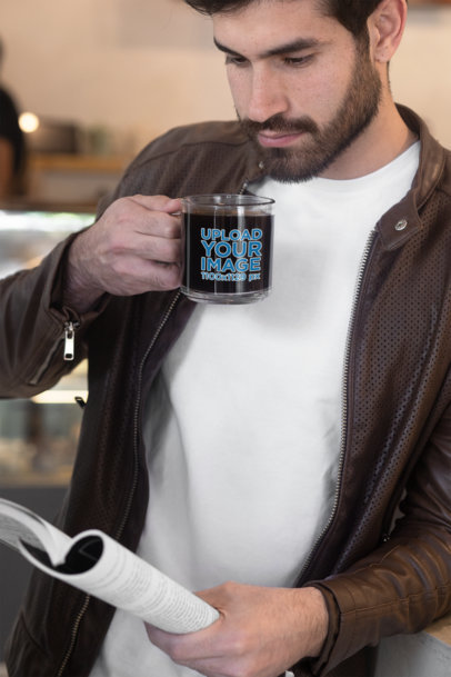 11 oz Glass Mug Mockup Featuring a Bearded Man Drinking Coffee and Reading 