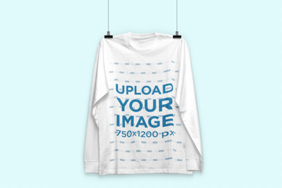 Mockup of a Long Sleeve Tee Hanging Against a Customizable Background