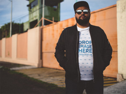 Round Neck Tee Mockup of a Hispanic Man Wearing a Hat and Sunglasses