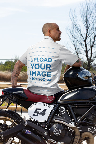 Back View Mockup Featuring a Man with a Button-Up Shirt Sitting on His Motorcycle 