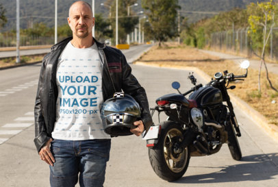 T-Shirt Mockup Featuring a Biker Posing Near His Motorcycle 