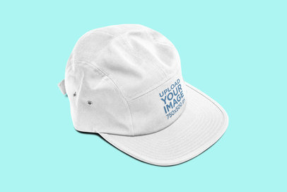Mockup of a 5-Panel Hat Placed on a Solid Color Surface