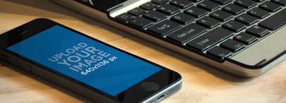 Mockup of an iPhone 5s Placed on a Work Desk 