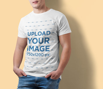 Cropped Faced Mockup of a Man Wearing a Customizable T-Shirt at a Studio