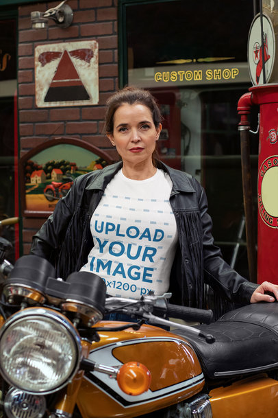 T-Shirt Mockup of a Fierce Woman Posing with Her Motorcyle