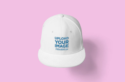 Mockup of a Snapback Hat Placed Against a Colored Background 
