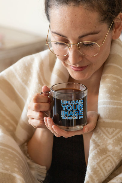 Clear Glass Mug Mockup Featuring a Woman in a Cozy Setting