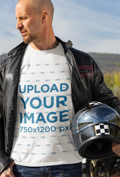 T-Shirt Mockup Featuring a Biker Holding His Helmet 