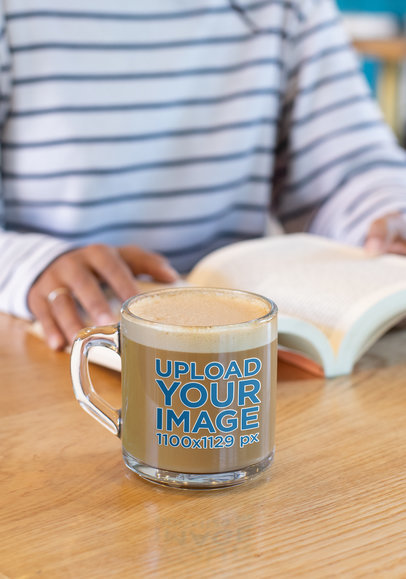 11 oz Glass Mockup of a Woman Reading a Book