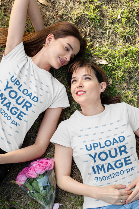 T-Shirt Mockup Featuring Mom and Daughter Lying Down in a Park 